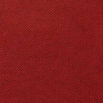 Red woven fabric sample displaying a dense, uniform texture with a matte finish and subtle tonal variations in a grid pattern.