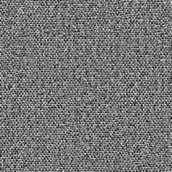 Granular monochromatic texture composed of irregular gray and black elements, displaying a complex, non-repeating pattern and a sense of visual depth.