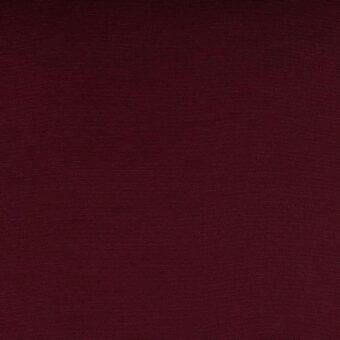Ruby red fabric sample, tightly woven textile with uniform grid pattern, matte finish, potentially velvet or plush synthetic fiber, Lacividina collection.