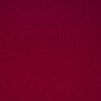 Crimson fabric texture sample displaying a matte, woven surface with tonal variations and a saturated red color, evenly lit for detail.