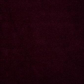 Burgundy velvet fabric texture with a dense pile and uniform color, displaying a muted wine-red hue; lacividina Superb collection sample.