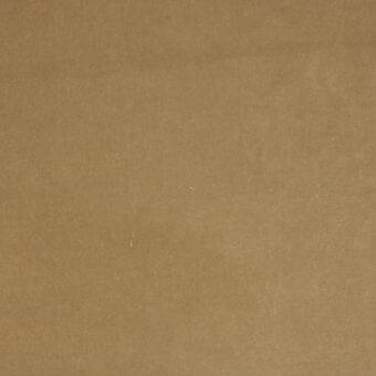 Tan woven fabric sample with matte finish, displaying subtle tonal variations and a consistent flat structure; lacividina brand label visible.