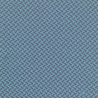 Woven fabric, light blue and gray, displays a dense geometric pattern with a textured, nubby surface and uniform weave.