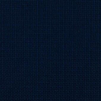 Navy blue woven fabric displaying a grid-like texture with rectangular elements, exhibiting a dense, uniform weave and tactile quality.