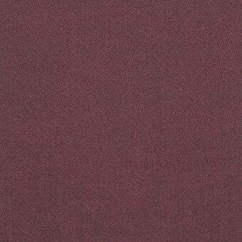 Burgundy textile sample with a dense, dotted weave and matte finish, displaying subtle color variation and a uniform, durable fabric structure.