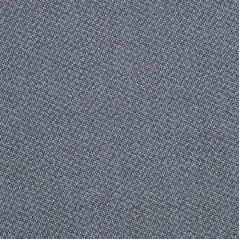 Gray woven fabric sample with a diagonal weave pattern and granular texture, displaying varying shades of gray in a rhythmic composition.