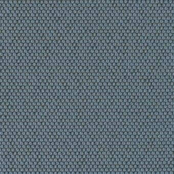 Blue woven fabric displaying a dense grid of circular elements with raised centers, exhibiting a consistent texture and uniform weave.