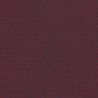 Burgundy fabric sample with dense, granular texture and dark flecks; looped pile construction, matte finish, “credo 01727.92ubin” imprint.