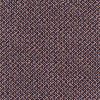 Navy blue jacquard fabric with dense coral-pink floral pattern and light blue flecks, displaying a textured, repeating textile design.