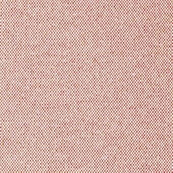 Coral dot pattern fabric with white background, dense weave texture, subtle irregularity, warm neutral palette, studio lighting.