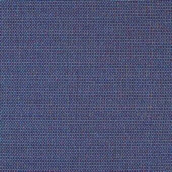 Blue-gray woven fabric sample with dense, irregular threads in blue, gray, green, and red tones; matte finish; labeled “35 trio” & “b chew trio 703”.