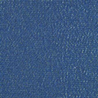 Blue woven fabric with yellow flecks, dense granular texture, heathered tonal variation, uniform speckled field, even studio lighting.