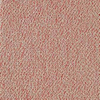 Woven textile with repeating red circular pattern on off-white, dense granular texture, uniform tight weave, durable fabric sample.