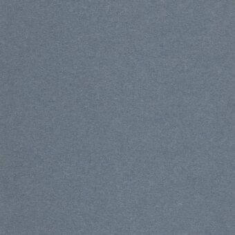 Cool-toned blue-gray textile sample with a dense, matte texture resembling felt; even lighting highlights the fabric’s brushed surface.