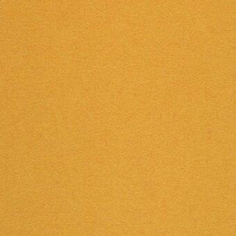 Mustard yellow fabric sample with a granular woven texture and matte finish, displaying a uniform color and subtle surface variation.