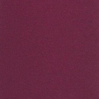 Burgundy fabric swatch displaying a matte, tightly woven texture with a consistent color and subtle surface variation, likely natural fiber.