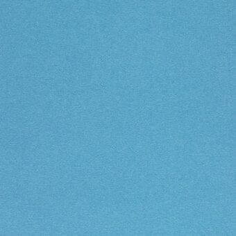 Blue fabric texture, matte finish, woven material, granular surface, solid color, neutral background, studio shot, textile sample.