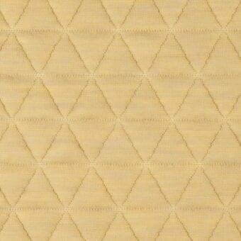 Diamond quilted fabric texture in light yellow, featuring consistent horizontal and vertical stitching and a smooth, uniform woven construction.