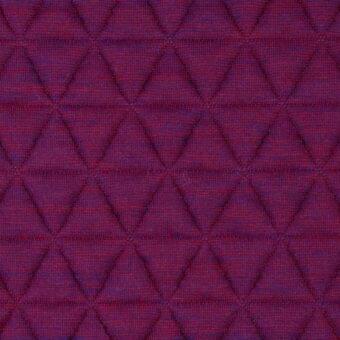 Quilted fabric texture, blueberry color, diamond pattern with tonal variations and visible stitching; Lacividina “41 triangle” fabric sample.