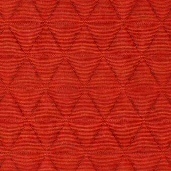 Red quilted fabric with diamond pattern, woven texture, matte finish; lacividina 41 triangle, triangle flame textile sample.