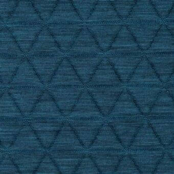 Teal quilted fabric with repeating triangle pattern, featuring tonal stitching and a subtle sheen; Lacividina “triangle hydro” textile.