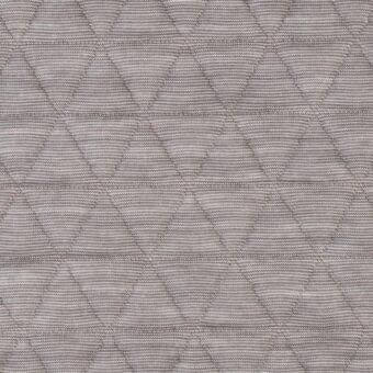 Gray quilted fabric with diamond pattern, raised texture from stitching, dense weave; Lacividina “41 triangle” fabric (special) textile.