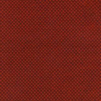 Terracotta fabric texture with repeating circular nodes in a grid pattern, dense weave, and subtle tonal variations, studio shot.