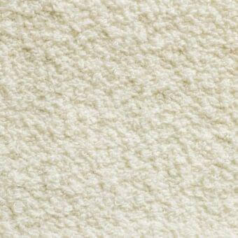 Off-white looped pile fabric texture with nubby, irregular surface; uniform weave, subtle tonal variations, “amelia 100” printed label.