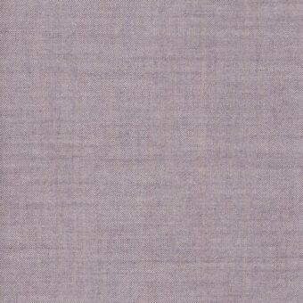 Lavender fabric sample with a dense dot pattern and irregular weave, exhibiting a soft matte finish and linen-like texture.
