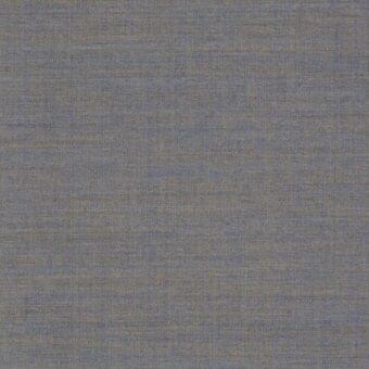 Gray fabric texture with heathered golden-brown threads, displaying a dense, matte plain weave and subtle irregular pattern.