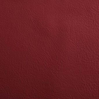 Red leather texture sample displaying natural grain, matte finish, and subtle burgundy tones; Lacividina Imperial collection label visible.