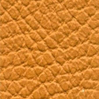 Quilted leather texture in golden-brown, displaying a diamond pattern with matte finish and tonal variations; sample labeled “427”.