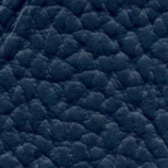 Navy blue looped leather texture sample displaying a nubby, irregular surface with varied pile height and a matte finish, labeled “lacividina leather (lux)”.