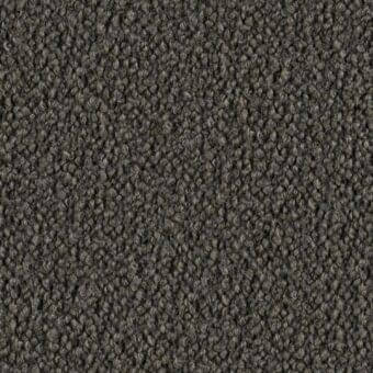 Dense looped pile fabric in gray-brown tones, exhibiting a consistent nubby texture and matte finish, labeled “lago > fabric > barnum”.