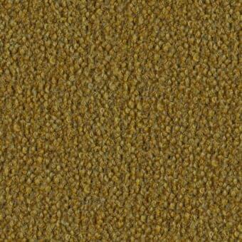 Mustard yellow looped pile fabric with speckled gray-brown tones, featuring a coarse, nubby texture and random looped pattern; label reads "lago > fabric > barnum".