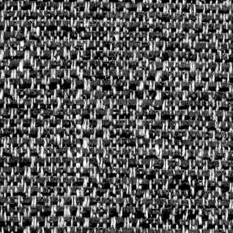 Gray tweed fabric texture displaying a dense, irregular plain weave with visible silver and charcoal threads and a fabric code label.