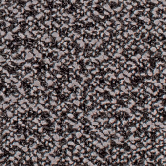 Dark gray speckled texture with light gray and white irregular particles, creating a dense, granular composite surface with diffused lighting.