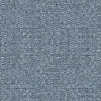 Woven fabric sample in blue-gray, exhibiting a dense, matte texture with subtle heathering and uniform weave; reference label present.