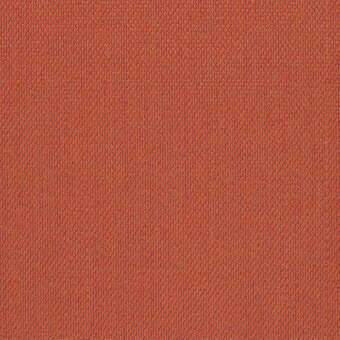 Terracotta fabric sample with a dense, looped pile texture; subtle mottled color variations and a matte finish, identified as Kvadrat Steelcut Trio.
