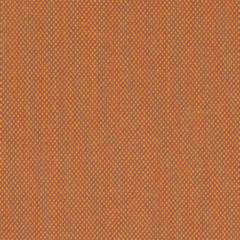 Steelcut Trio Kvadrat fabric displays a dense, warm orange woven texture with dark brown, gray, and purple accents, exhibiting a raised, irregular pattern.