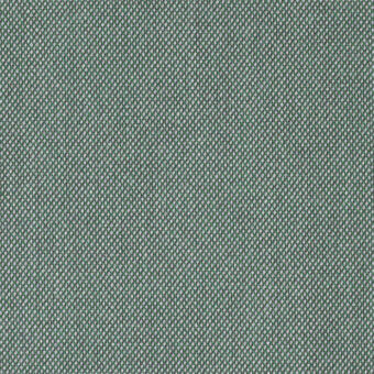 Kvadrat Steelcut Trio fabric, muted green textured weave with gray and off-white speckles, dense matte upholstery material.
