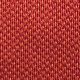 Terracotta fabric texture with a dense, looped weave and nubby surface displaying tonal variations and a compact, durable construction.