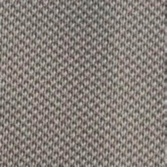 Woven etis fabric sample in muted gray features a dense, granular texture with a matte finish and repeating nubby nodes, MDF Italia collection.