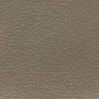 Beige fabric sample “time tl15” from MDF Italia, exhibiting a fine, pebbled grain and consistent raised texture in a warm, muted tone.