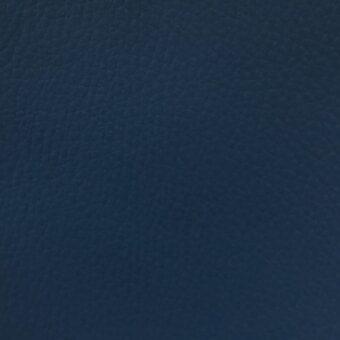 Denim blue fabric sample “time tl15” from MDF Italia, exhibiting a pebbled texture and matte finish with a fine grain pattern.