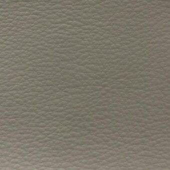 MDF Italia fabric sample, light grey pebbled texture, “time tl15” r888 col. 6777, matte finish, tightly woven, subtle tonal variations.