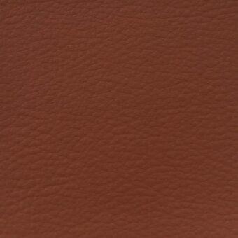 Rust fabric texture, MDF Italia collection, R892 col. 12410, displays a fine, pebbled grain and warm terracotta tones in diffused studio lighting.