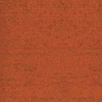 Rust fabric sample with dense fibrous texture, mottled orange-brown tone, and uneven surface from MDF Italia’s fabric collection.