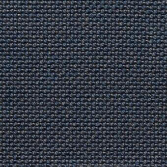 Denim blue “ramiro” fabric sample, MDF Italia collection, displays a dense, textured, open-hole weave with heathered gray threads.