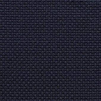 Navy blue fabric sample with dense, circular node texture and subtle tonal variations; structured, possibly synthetic weave.